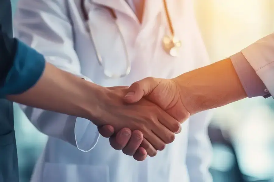 Doctor shaking hands with patient