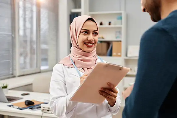 Female physician smiling in her cabin