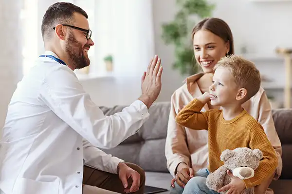 Kid smiling with physician