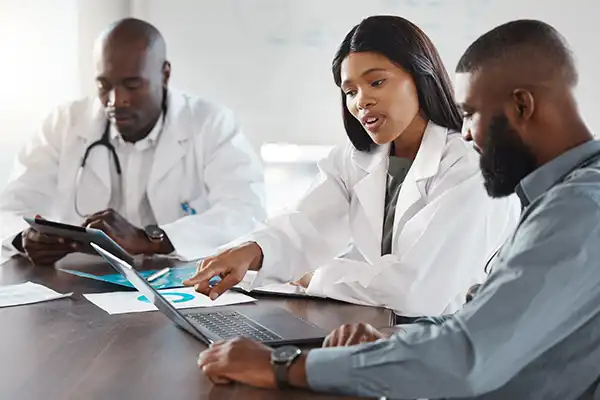 Physicians discussing medical data