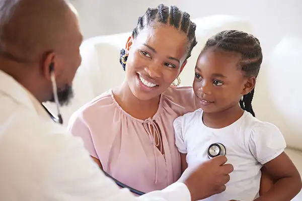 a kid and her mother in clinic