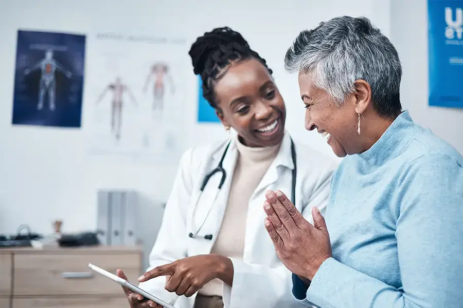 doctor and elderly patient interacting