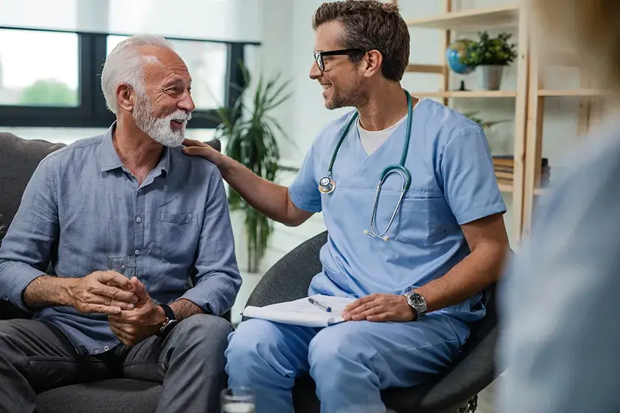 old patient with young physician discussing