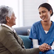 a young nurse chatting to a senior woman