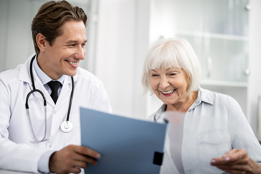 smiling-to-his-happy-elderly-patient