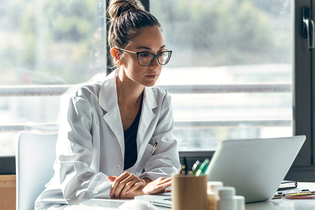 Female doctor talking while explaining medical treatment