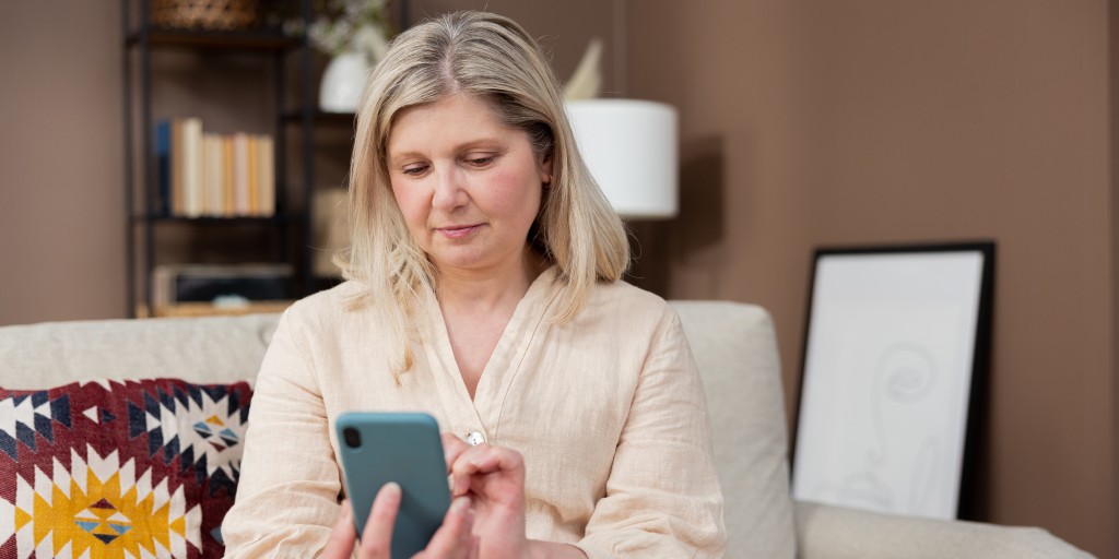 woman-holding-smartphone-using-mobile-app