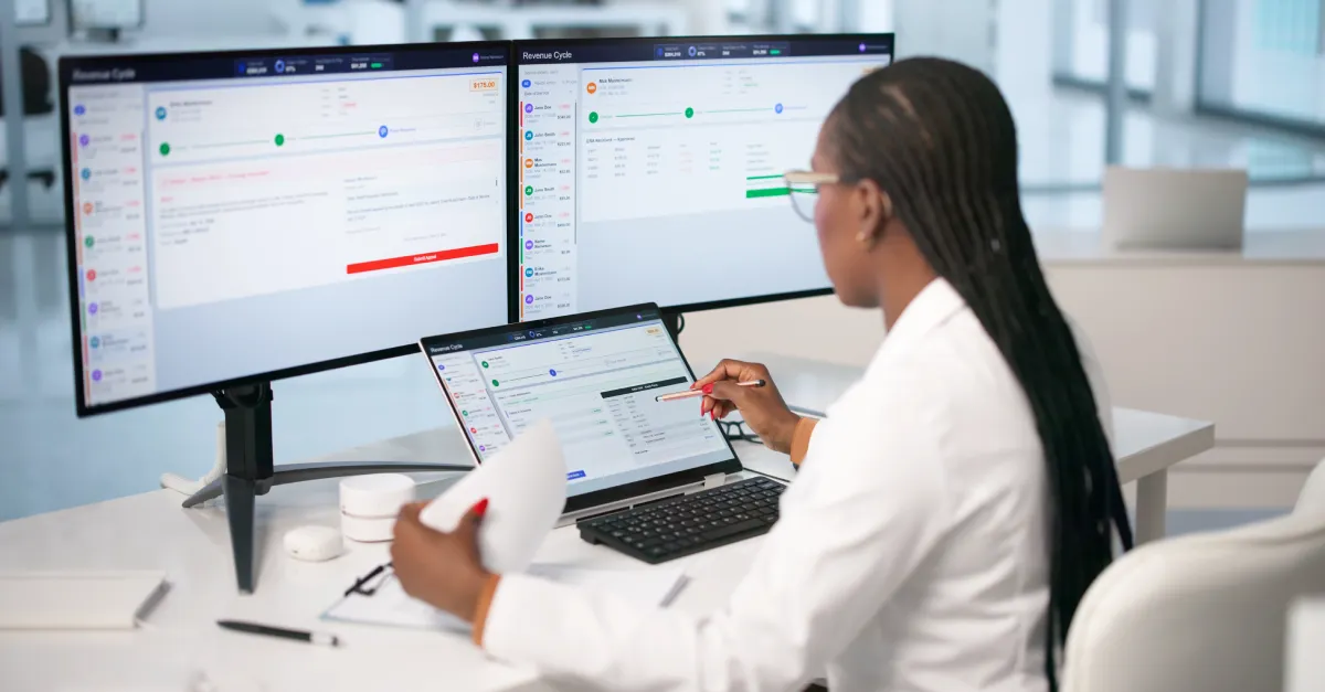 Young Woman Uses Laptop To Review Medical Billing