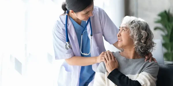 Female doctor give empathy encourage retired patient