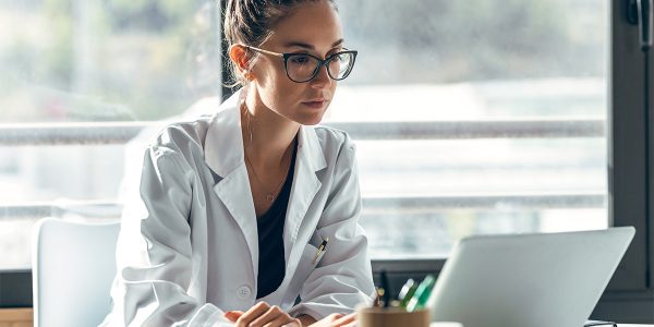 Female doctor talking while explaining medical treatment