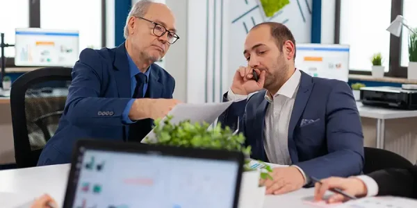 Financial entrepreneurs analysing discussing documents