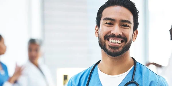 Happy-Physician-with-tablet-in-hand