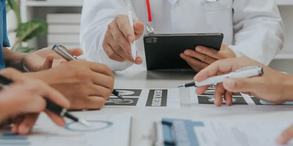 Medical analysts and physicians consult documents
