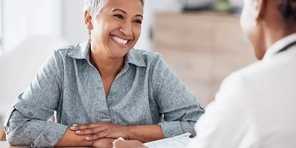doctor consulting a happy patient