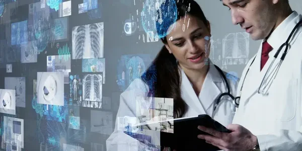 female and male physician discussing medical records on tablet