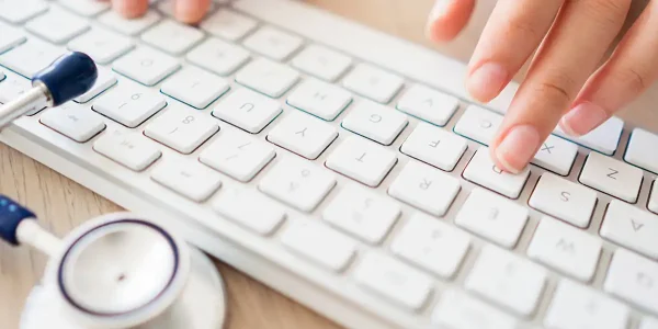 female physician typing