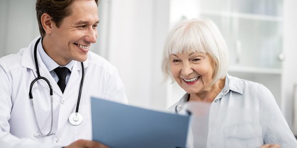 smiling-to-his-happy-elderly-patient